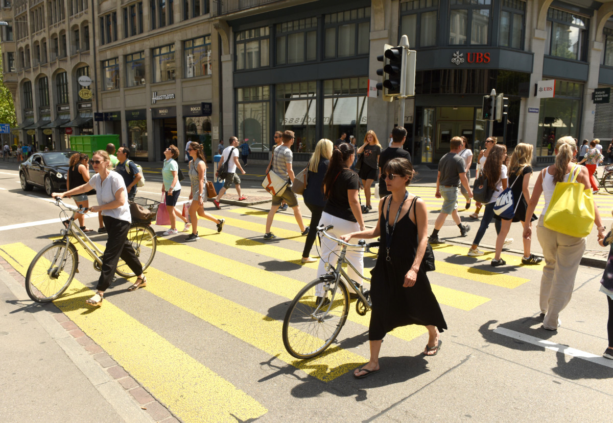 People on zebra crossing in Zurich. Daily life in Zurich.