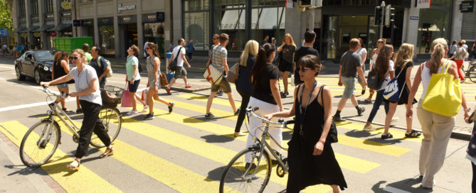 People on zebra crossing in Zurich. Daily life in Zurich.